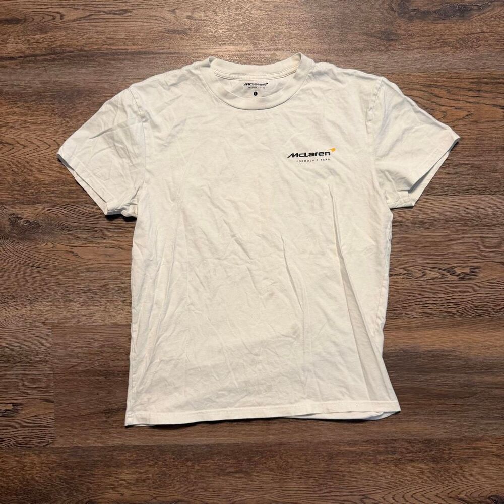 McLaren F1 2023 white t-shirt with orange/black race car graphic and checkered f - Picture 4 of 6